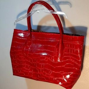 PRICE JUST DROPPED...Fun, bright red overnight bag.